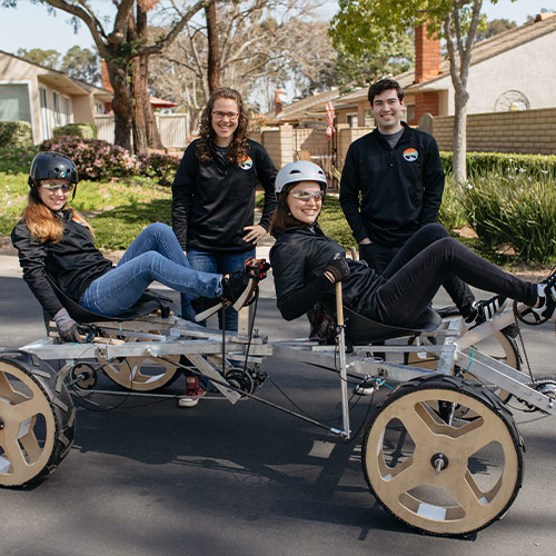 Students posing with the rover